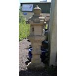Reconstituted stone plinth of Lotus Leaf design the ball finial over an octagonal top and collared