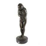 20th century bronze sculpture of a semi nude girl standing wrapped in a shawl, the base signed