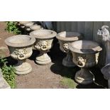 Set of four reconstituted stone and campana shape garden planters, with lion mask handles and