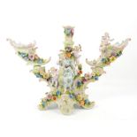 Continental porcelain centrepiece with two cornucopias flanking a central candleholder,