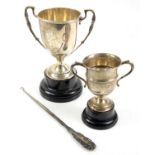 Two silver trophy cups 12.63oz 392.8gm and a boot hook