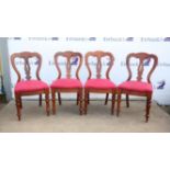 Set of four late Victorian walnut dining chairs, the shaped backs with pierced vase shaped splats