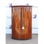 Early 19th century inlaid mahogany bowfront hanging corner cupboard, H107 W71 D50 cm