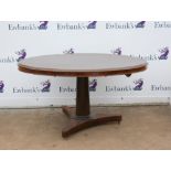 19th century style mahogany snap top breakfast table, the oval top above a turned tapering stem,