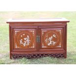 Chinese mother of pearl inlaid hardwood cabinet, the panelled top over a pair of cupboard doors and
