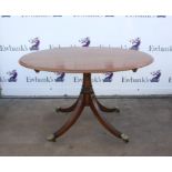 Early 19th century style mahogany snap top centre table, the oval top on a central stem with four