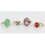 Collection of four 9 ct gold dress rings, including an oval cut amethyst, a coral cluster,