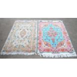 Tabriz wool rug with silk highlights, the pink medallion and border on a light blue field,