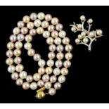 Mikimoto pearl brooch mounted in silver, and a pearl necklace with a stamped 9 ct gold clasp