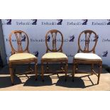 Set of eleven Continental dining chairs, with oval backs above drop in seats on fluted turned legs,