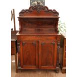Victorian mahogany chiffonier, the raised carved back over a frieze drawer and panelled doors with