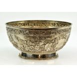 Chinese export silver bowl, embossed with a dragon border above chrysanthemums, maker's mark LH,