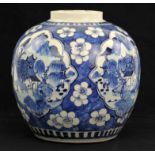 A Chinese blue and white ginger jar, late 19th century decorated with four ogee shaped panels