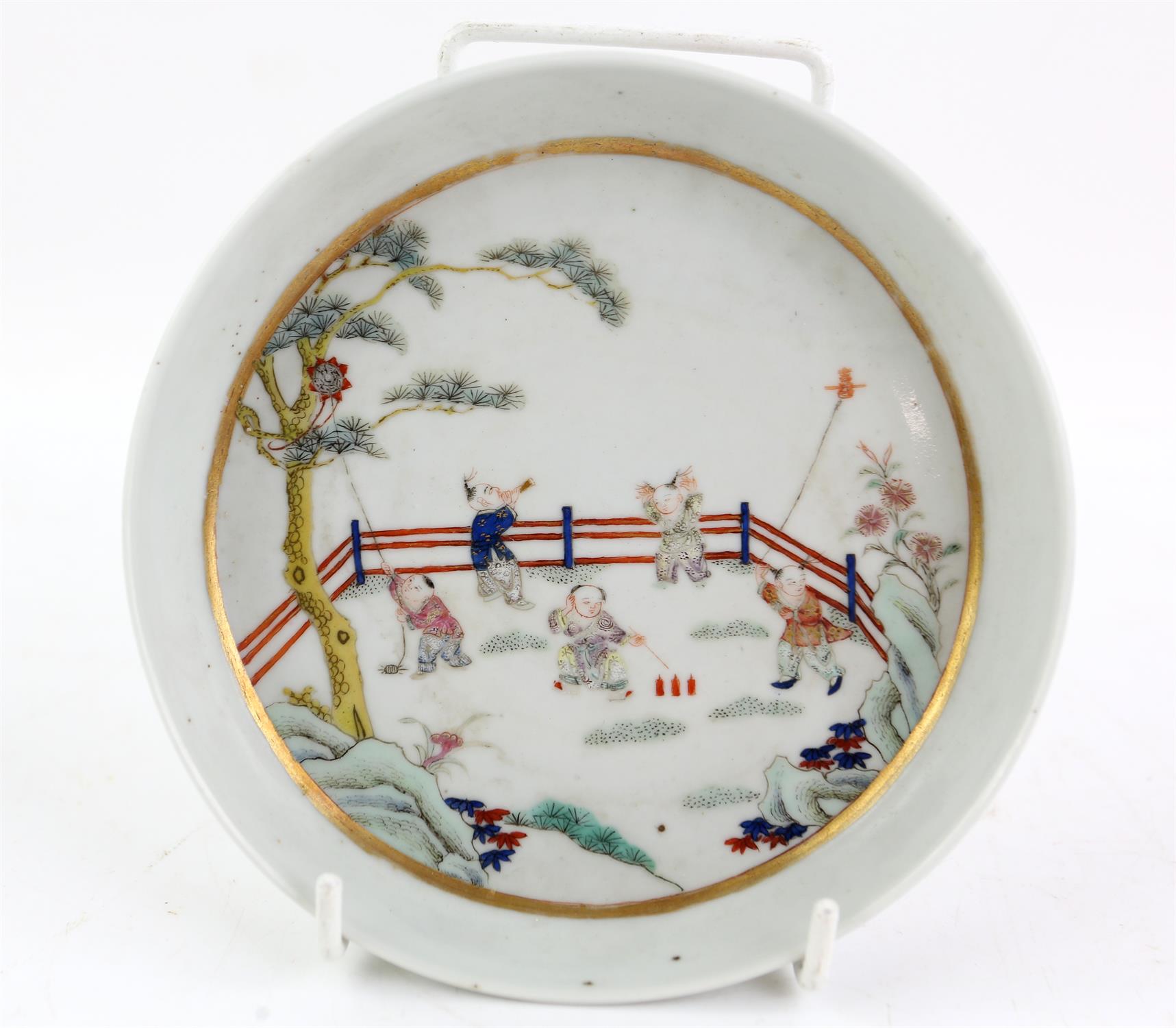 A Chinese Saucer with Children Playing in a Garden. Qing dynasty Painted with young boys playing