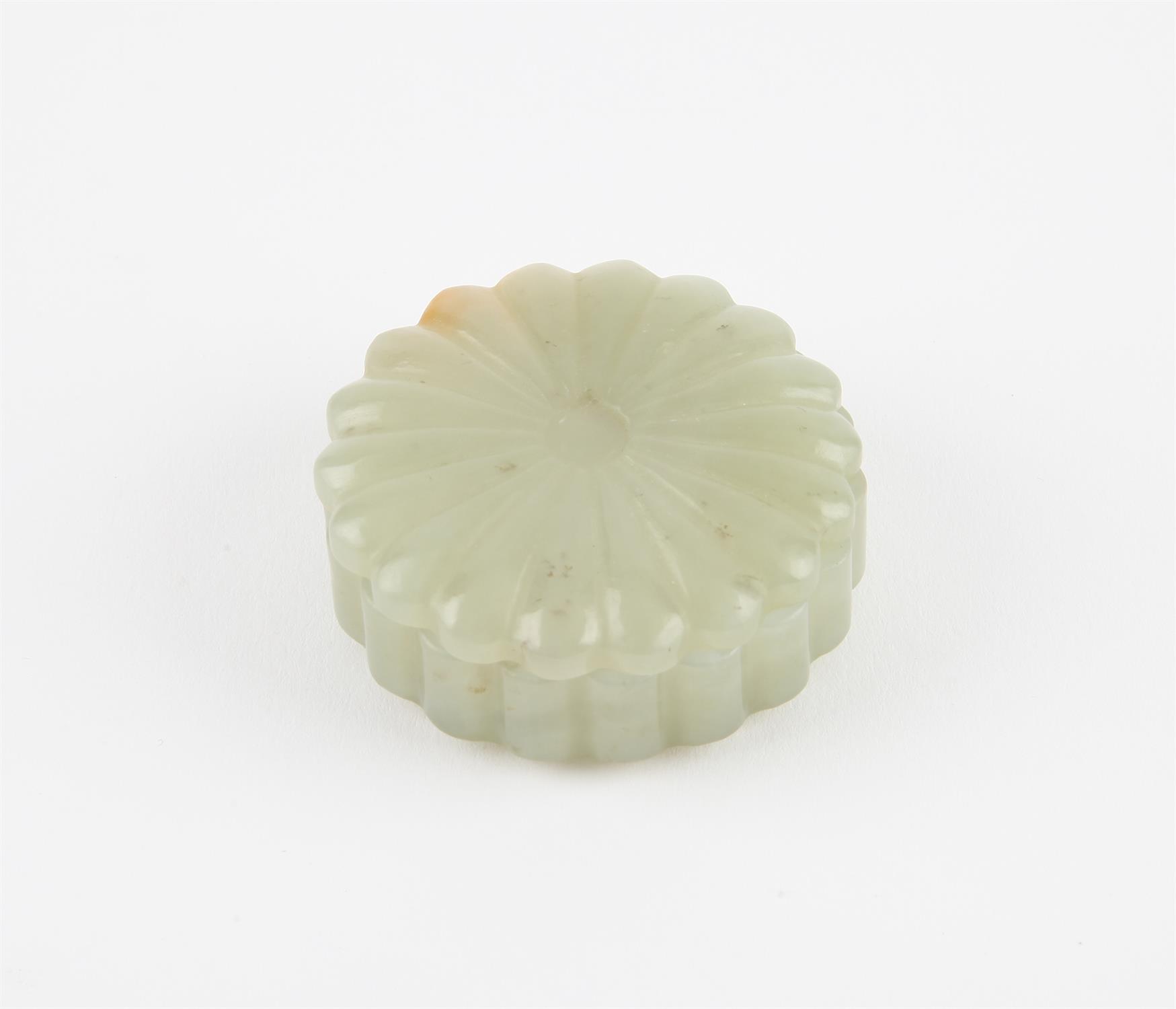 Small Chinese carved jade box and cover, Qing dynasty. Carved in chrysanthemum pattern.