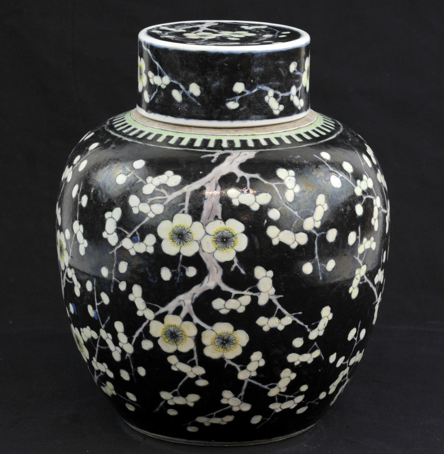 A Chinese Famille Noire Jar with Cover. Qing dynasty. Painted with flowering prunus design,