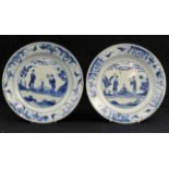 A pair of Chinese blue and white dishes, Qing dynasty, Kangxi period painted with two ladies on a