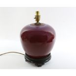 A Chinese Langyao oxblood jar mounted as lamp. Late Qing dynasty the ovoid jar with purple and blue