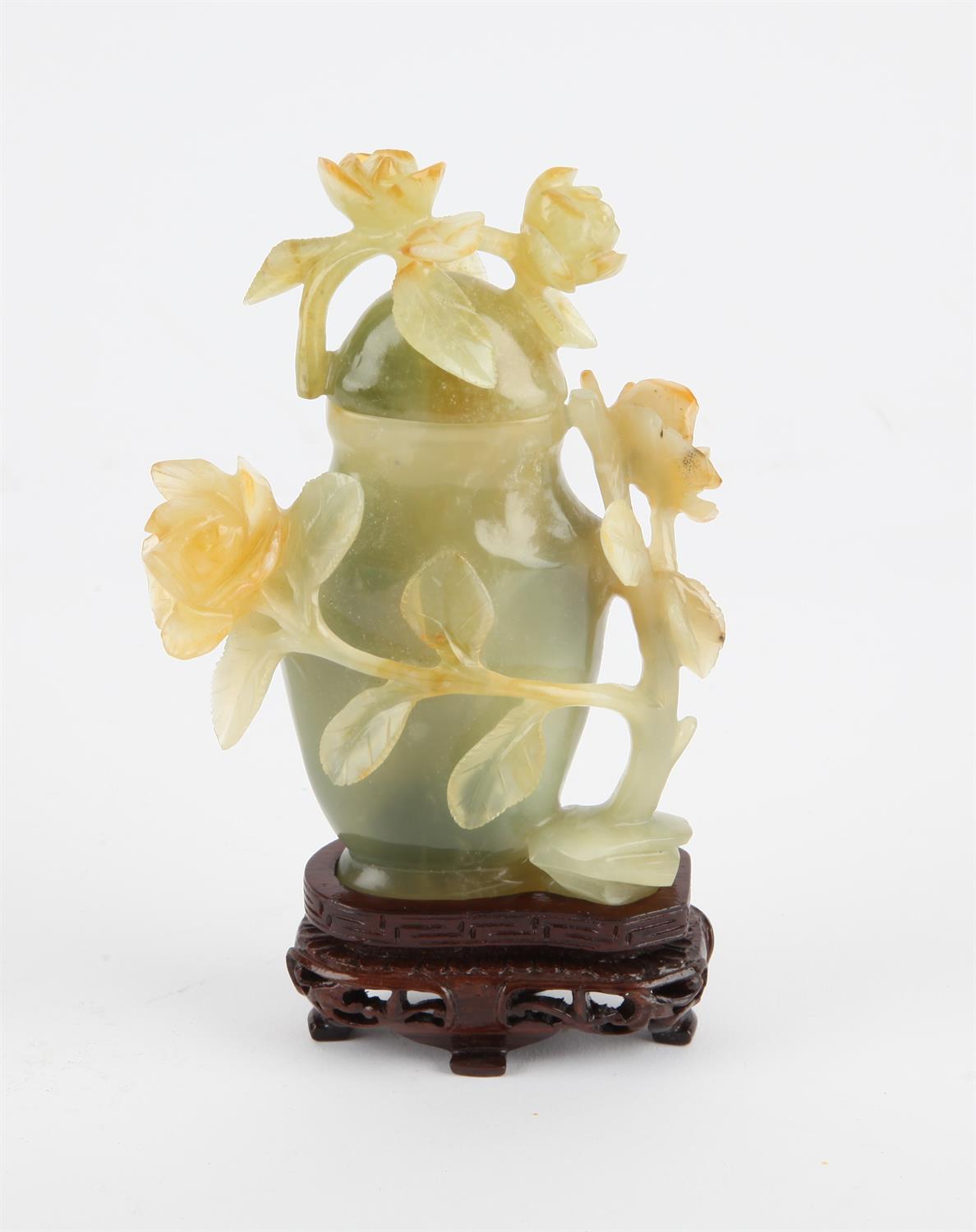 Chinese jade lidded jar decorated with carved flowers and vines. 20th century 12 cm High.