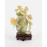 Chinese jade lidded jar decorated with carved flowers and vines. 20th century 12 cm High.