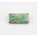 Chinese silver and jade brooch, Republic period, c1920. The Jade carved with a floral design. 4.