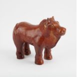 A large Chinese chestnut–glazed pottery figure of a bull, Tang dynasty (618-907).