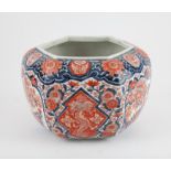 A Japanese Imari Hexagonal Jardiniere, Meiji period. Painted with flowers , dragons , birds,