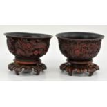 A Pair of Chinese Cinnabar Bowls with Dragons , Late Qing dynasty early republic Depicting two