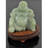 Large jade Buddha, holding a gourd in one hand and a rosary on the other hand. 12 cm high.