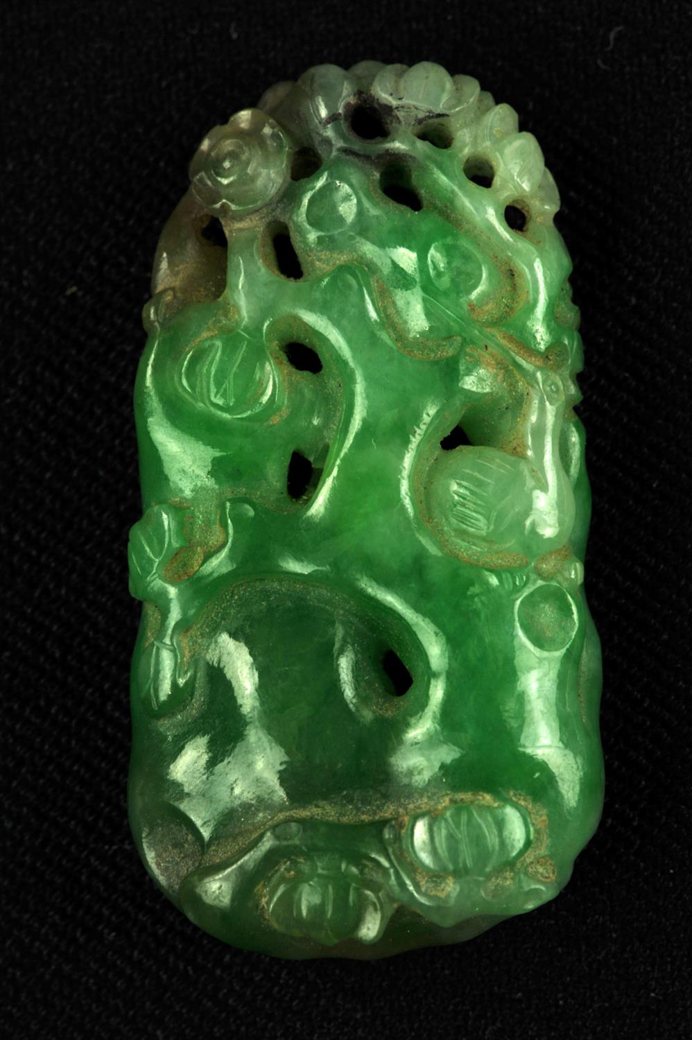 A Jadeite pendant , Qing dynasty or Republic period . Carved with a crane in foliage background . 3.