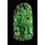 A Jadeite pendant , Qing dynasty or Republic period . Carved with a crane in foliage background . 3.
