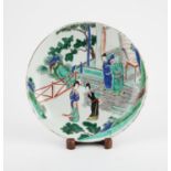 A Chinese Famille Verte – Imari Charger. Qing dynasty painted with two ladies on a garden and two