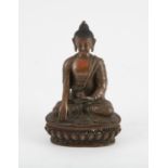 A Tibetan sitting bronze Buddha. Seated in Dhyanasana, holding a bowl in one hand, on a lotus base.
