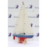 Radio controlled model pond yacht 'Fair Wind', on stand, 92cm long,