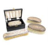 Cased two piece silver christening set and 3 brushes