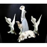 Lladro figure of a lady with a Borzoi hound, 40 cm high (parasol missing), a pair of Lladro Doves