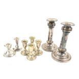 Two silver and six silver-plated candlesticks
