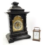 Brass and four glass carriage clock with lever movement, Roman numerals and an ebonised wood mantel