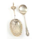Continental silver wine or caddy spoon and a English silver caddy spoon