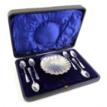 Cased set of silver spoons with shell design, and a shell form silver dish, London, 1913