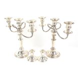 Pair of silver candlesticks and a pair of 3 branch silver plated candelabra
