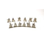 Set of six oriental white metal silver cutlery rests. Each rest with a pair of courtier/musicians