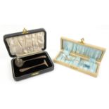 Cased two piece silver christening set and a cased silver and enamel spoon,