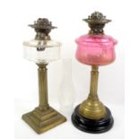 Two 19th century brass and glass oil lamps,