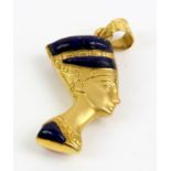 18ct gold pendant of Nefertiti's head decorated with coral to one side and lapis lazuli to the