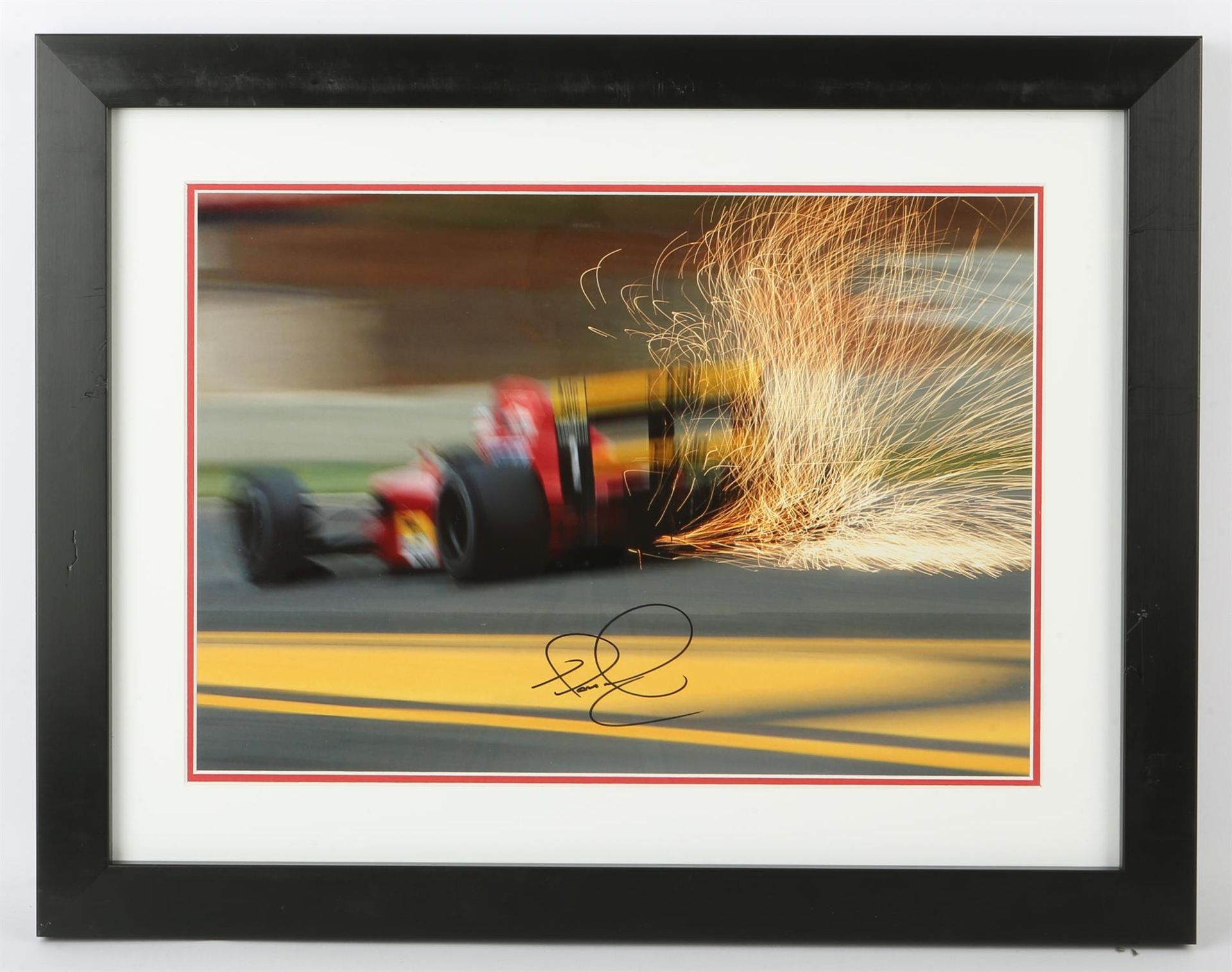 F1 photograph, signed by Nigel Mansell, framed and glazed, image size 29 x 42cm, bearing receipt