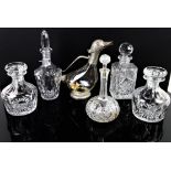 Pair of 19th century style facet cut decanters and stoppers, three other decanters and a claret jug