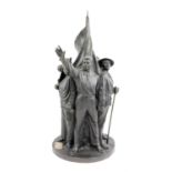 † Soviet Russian bronze figure group depicting workers of all Nations surrounding a flag,