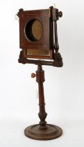 Late 18th century table mirror and magnifier (lacks lens), on a turned stem with circular foot 63.
