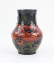 Moorcroft Poppy baluster vase, with blue ground, initials and impressed mark numbered 74, 12.